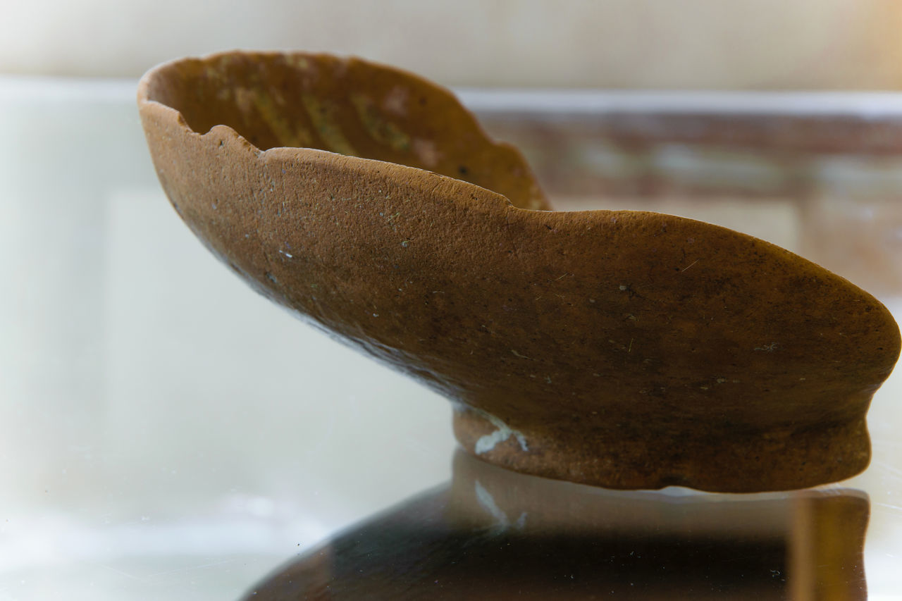 CLOSE-UP OF BREAD IN CONTAINER ON TABLE