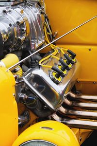 Close-up of yellow motorcycle