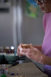 Midsection of woman holding ice cream