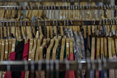 Close-up of coathangers in clothing store