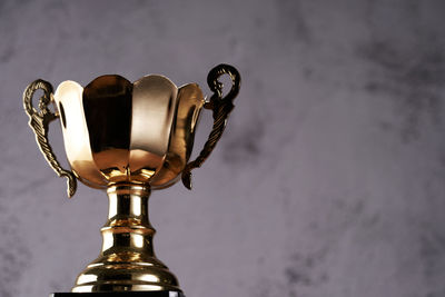 Close-up of trophy against wall