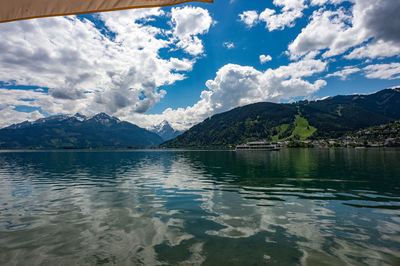 Scenic view of lake and mountains against sky