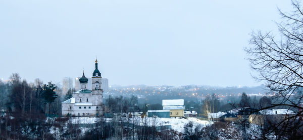 Buildings against clear sky during winter