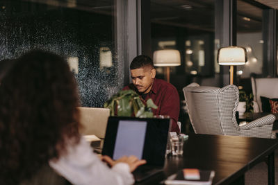 People sitting on table at home