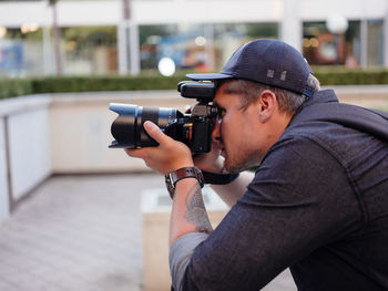 Man photographing with camera