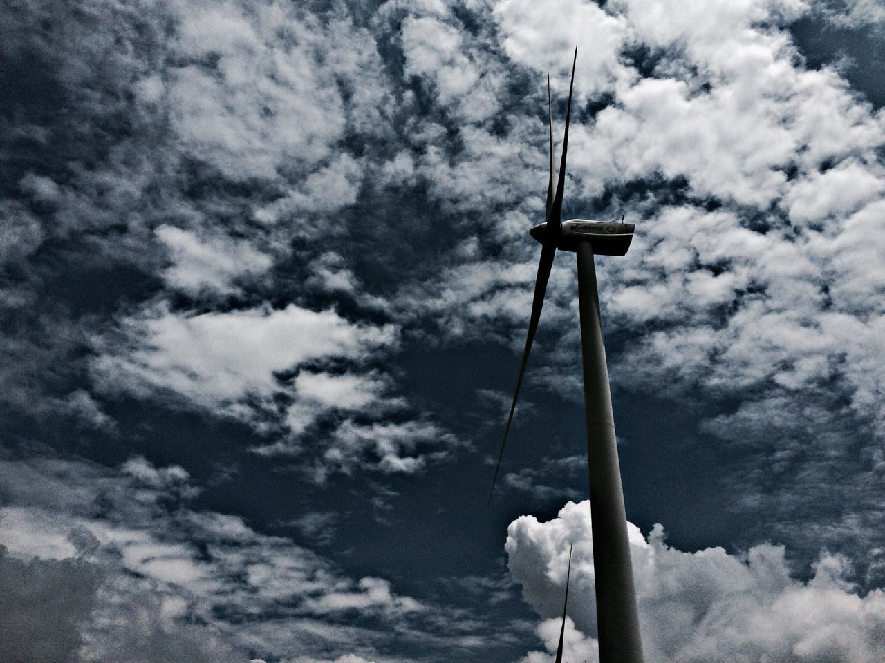 LOW ANGLE VIEW OF COMMUNICATIONS TOWER AGAINST SKY