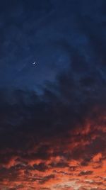 Low angle view of moon at sunset