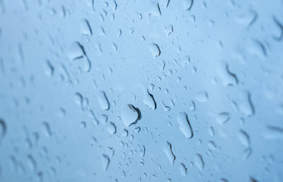 Full frame shot of wet glass window