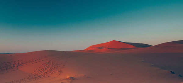 Scenic view of desert against clear sky