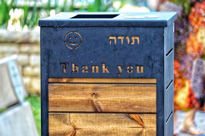 Close-up of text on wood