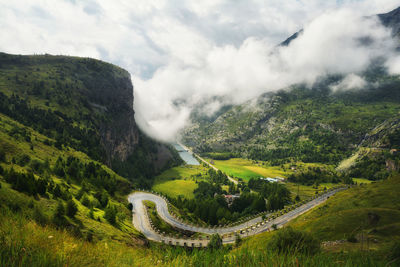 High angle view of mountain road against cloudy sky