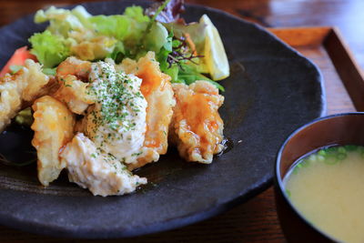 Close-up of fresh food served in plate at table