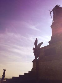 Low angle view of statue against sky