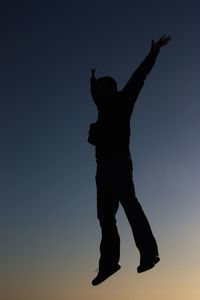 Low angle view of woman against sky