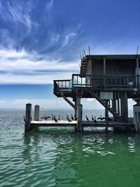 Pier over sea against sky