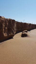 Rock formations in desert against clear sky