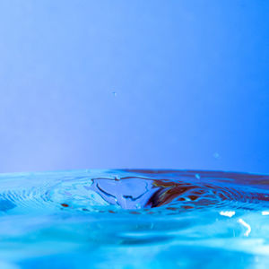 Close-up of water splashing on swimming pool