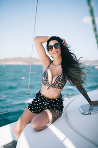 Young woman having fun on a boat