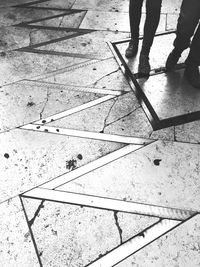 Low section of people walking on footpath