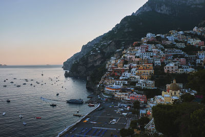 High angle view of sea and buildings against sky