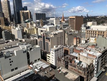 High angle view of buildings in city against sky