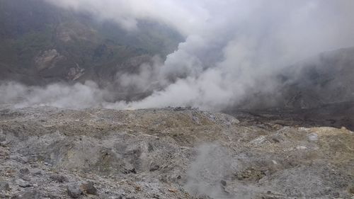 Smoke emitting from volcanic mountain