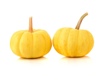 Close-up of pumpkins against white background