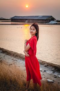 Portrait of woman standing on beach