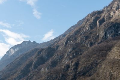 Low angle view of mountain range against sky