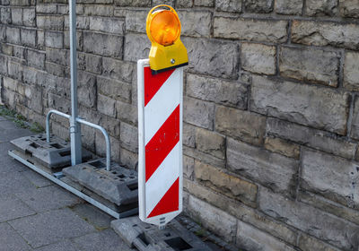 Road sign on wall