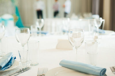 Close-up of wine glasses on table in restaurant