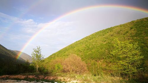 Low angle view of rainbow against sky