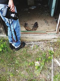 Low section of man holding back yard