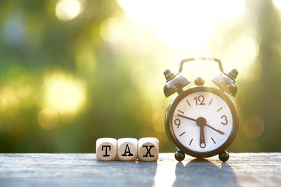 Close-up of clock on table