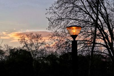 Low angle view of street light against sky