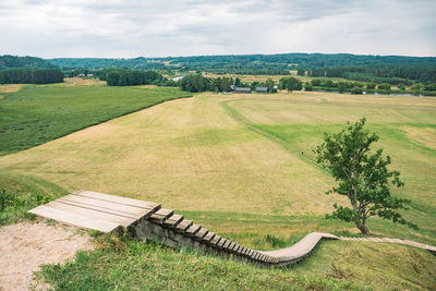 Scenic view of agricultural field against sky