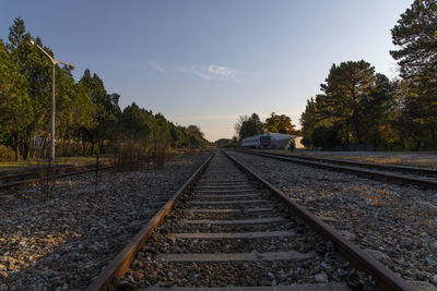 Surface level of railroad track against sky