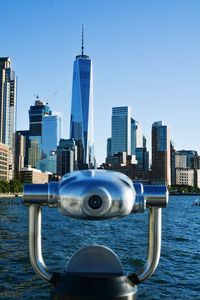 Modern cityscape against clear blue sky