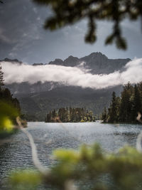 Scenic view of lake and mountains against sky