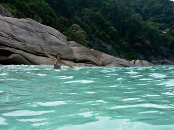 Scenic view of sea against rocks