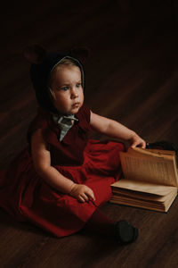 Toddler baby girl in funny hat with ears having fun