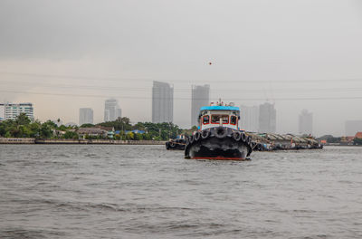 A tugboat at the chao phraya river in bangkok thailand southeast asia