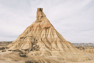 Low angle view of rock formations against sky