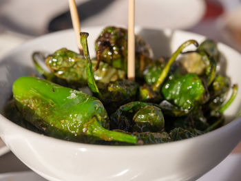 Close-up of green salad in bowl on table