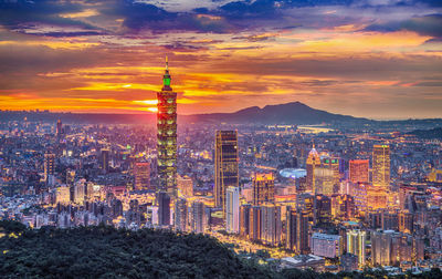 Aerial view of city buildings during sunset