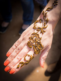 High angle view of woman holding hands