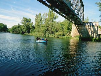 Scenic view of bridge over river against sky