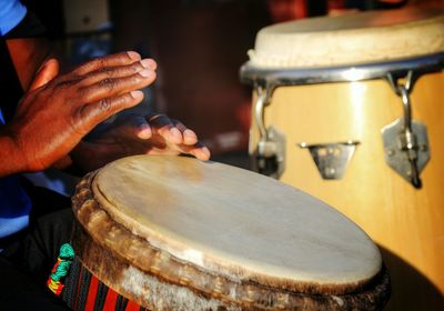 Detail shot of hands playing the drum