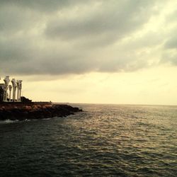 Scenic view of sea against cloudy sky