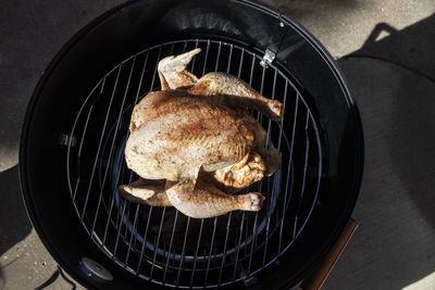 High angle view of meat cooking on barbecue grill